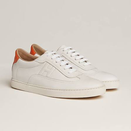 Pair of white leather sneakers used for the search